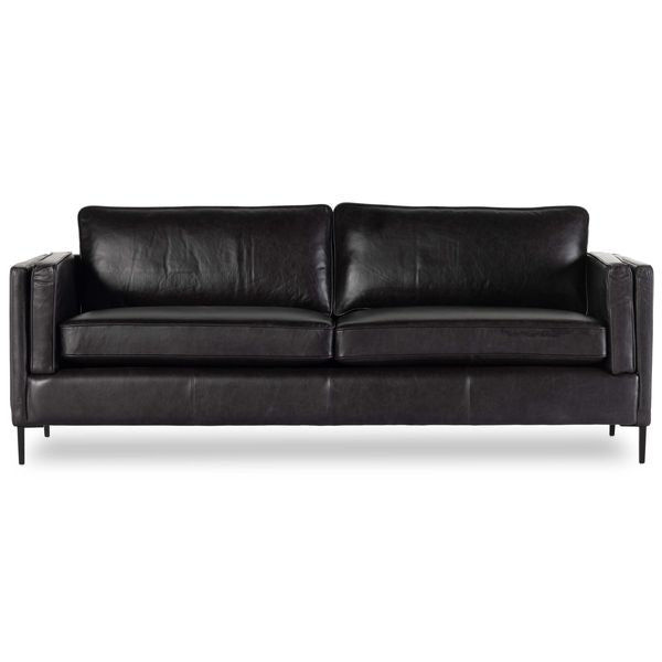 Sofa tapicerowana o miekkim zarysie z wyraznym zarysem w odcieniu czerni