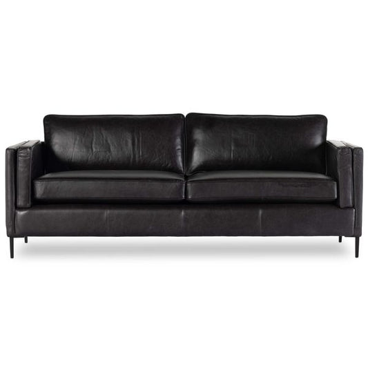 Sofa tapicerowana o miekkim zarysie z wyraznym zarysem w odcieniu czerni